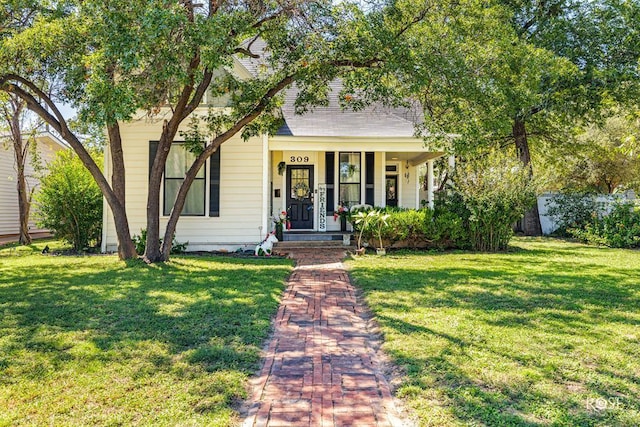 view of front of house featuring a front yard and covered porch