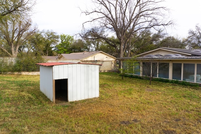 view of outbuilding with a lawn