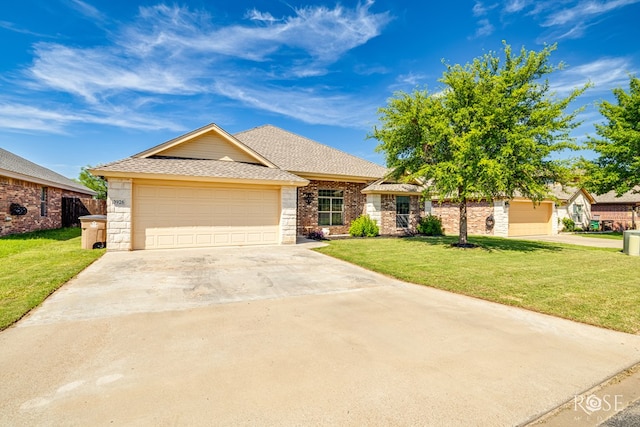 3926 Caroline Ln, San Angelo, TX 76904 - view of front of house featuring a front lawn, a shingled roof, concrete driveway, and an attached garage