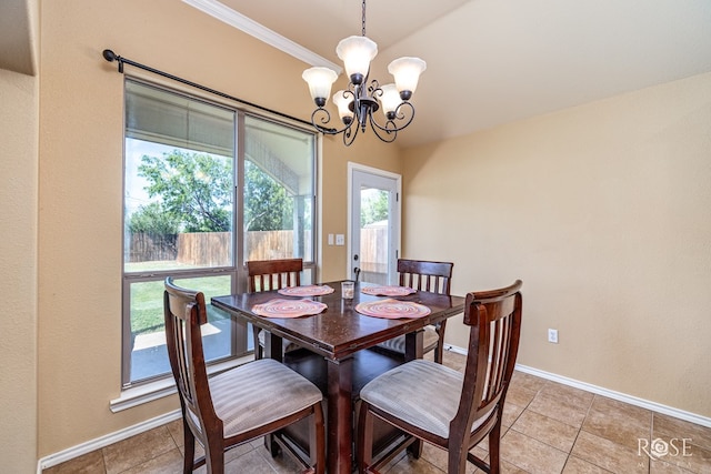 3926 Caroline Ln, San Angelo, TX 76904 - dining space with a chandelier, light tile patterned floors, and crown molding