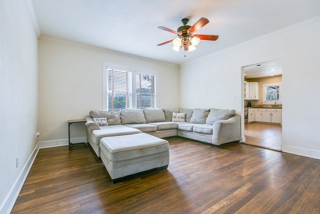 3805 Ogden St, San Angelo, TX 76903 - living area with ceiling fan, crown molding, dark wood-style flooring, and baseboards