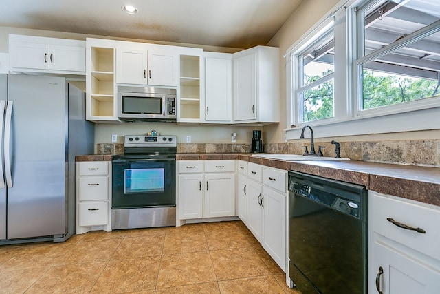 3805 Ogden St, San Angelo, TX 76903 - kitchen featuring appliances with stainless steel finishes, open shelves, a sink, white cabinetry, and recessed lighting