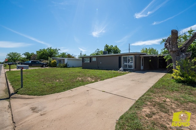 2123 Wilson St, San Angelo, TX 76901 - view of front of house featuring a front lawn, concrete driveway, and an attached carport