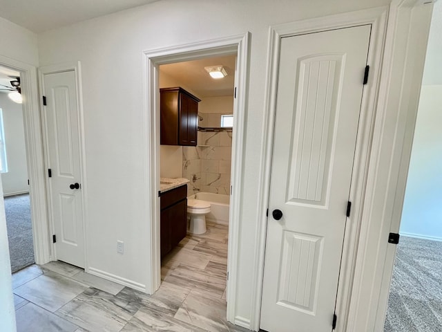 115 E 41st St, San Angelo, TX 76903 - bathroom with vanity, marble finish flooring, and a tub to relax in