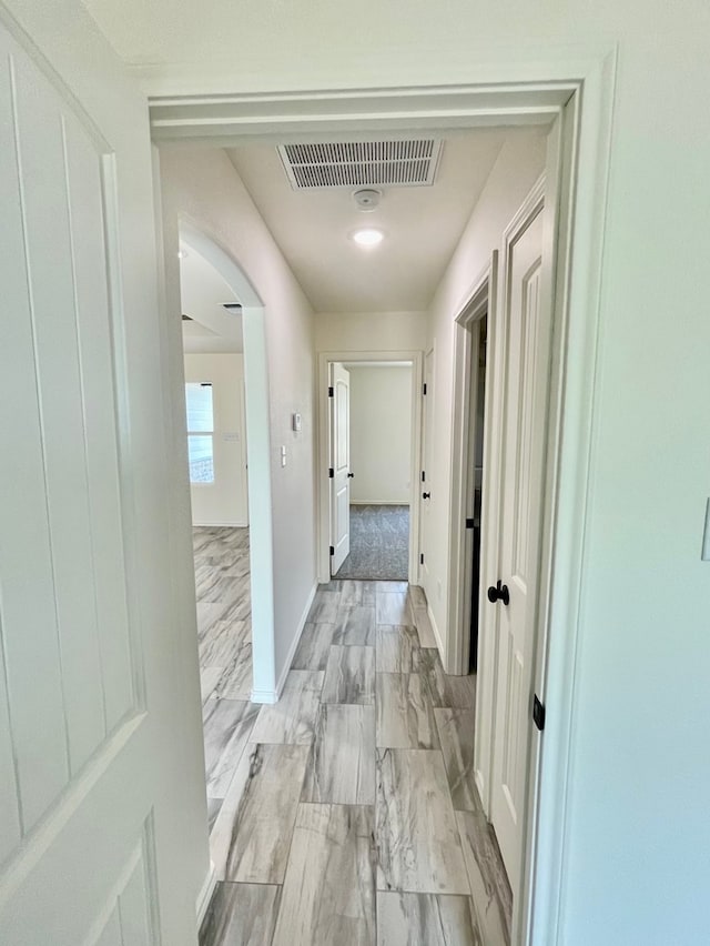 115 E 41st St, San Angelo, TX 76903 - hall with arched walkways and baseboards