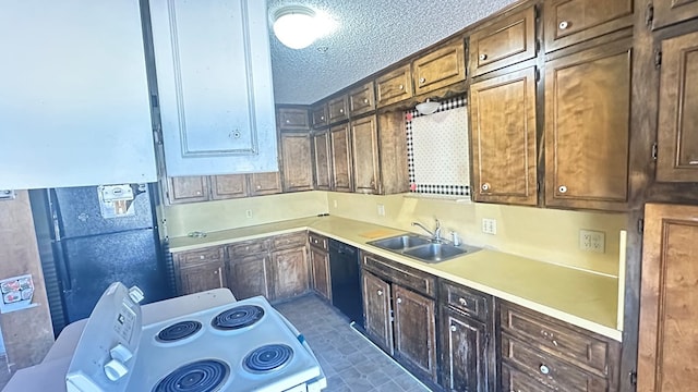 kitchen with black dishwasher, sink, white electric range oven, and a textured ceiling