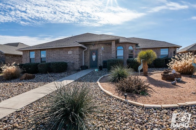 5010 Red Oak Ln, San Angelo, TX 76904 - ranch-style home with brick siding and a shingled roof