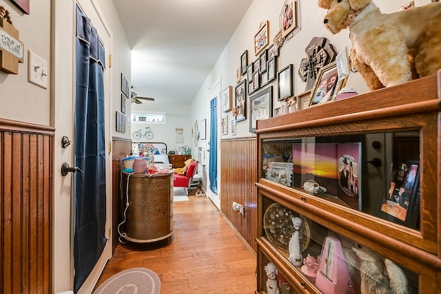 corridor with light hardwood / wood-style flooring