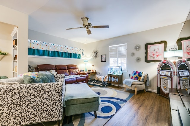 living room with dark wood-type flooring and ceiling fan