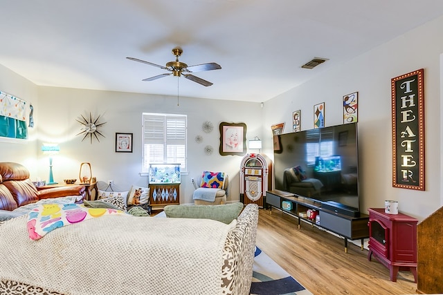 bedroom with light hardwood / wood-style flooring and ceiling fan