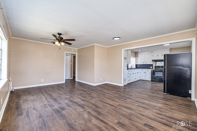 2105 Coleman St, San Angelo, TX 76901 - unfurnished living room with a ceiling fan, dark wood-type flooring, and crown molding
