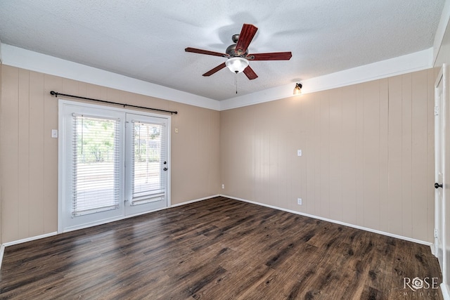 2105 Coleman St, San Angelo, TX 76901 - empty room with dark wood-style flooring, a ceiling fan, and a textured ceiling