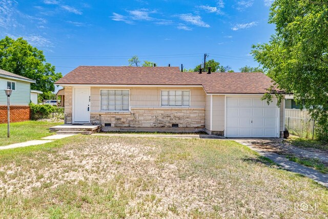 2105 Coleman St, San Angelo, TX 76901 - ranch-style house featuring stone siding, an attached garage, driveway, and a shingled roof