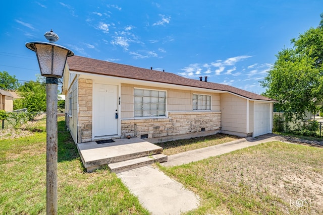 2105 Coleman St, San Angelo, TX 76901 - ranch-style house with stone siding and a garage