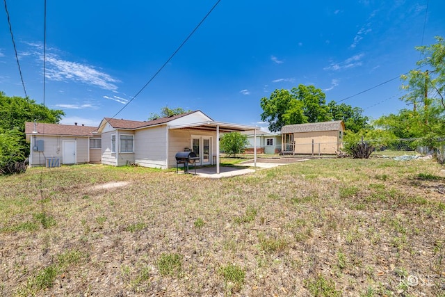2105 Coleman St, San Angelo, TX 76901 - rear view of property featuring a patio area and french doors