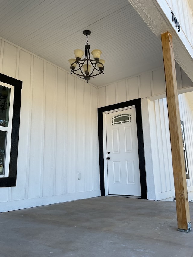 709 E Harris Ave, San Angelo, TX 76903 - doorway to property featuring board and batten siding