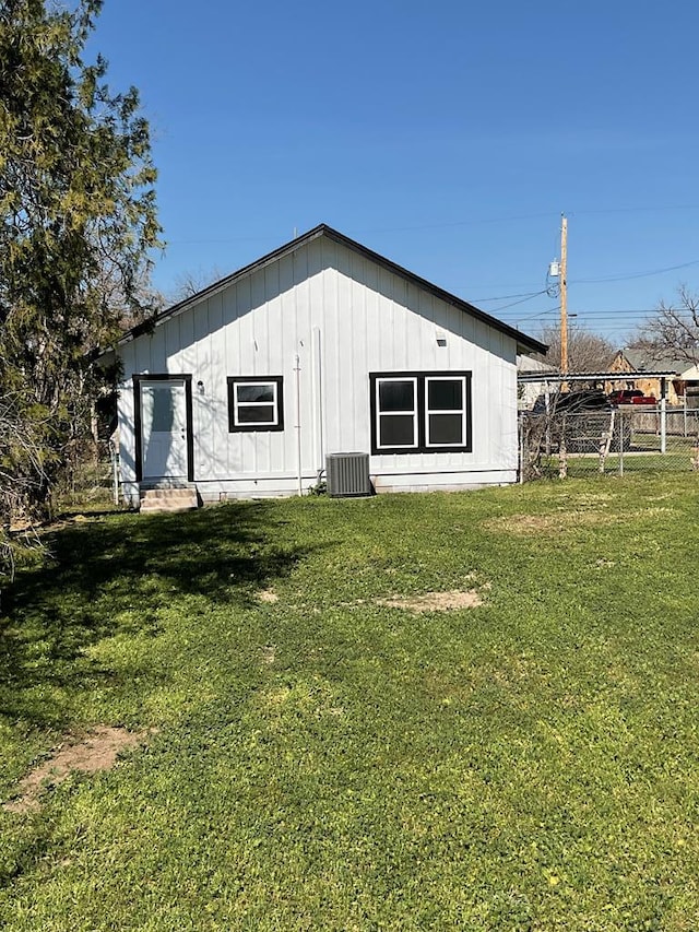 709 E Harris Ave, San Angelo, TX 76903 - back of property with central AC and board and batten siding