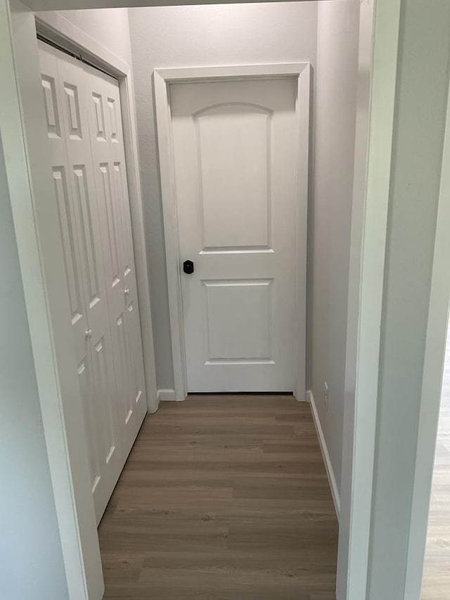 709 E Harris Ave, San Angelo, TX 76903 - hall featuring wood finished floors and baseboards