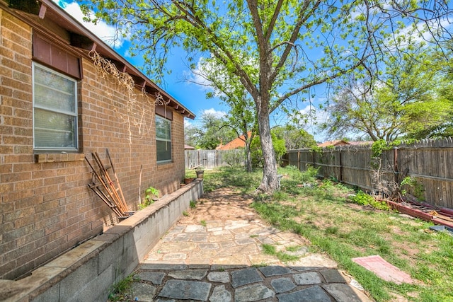 2756 Eunice Dr, San Angelo, TX 76901 - fenced backyard featuring a patio