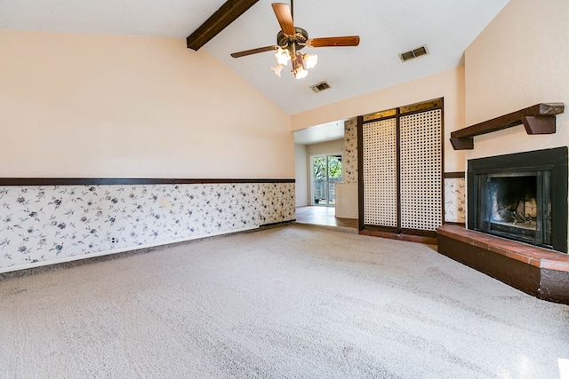 2756 Eunice Dr, San Angelo, TX 76901 - unfurnished living room with a fireplace with raised hearth, carpet floors, and a ceiling fan