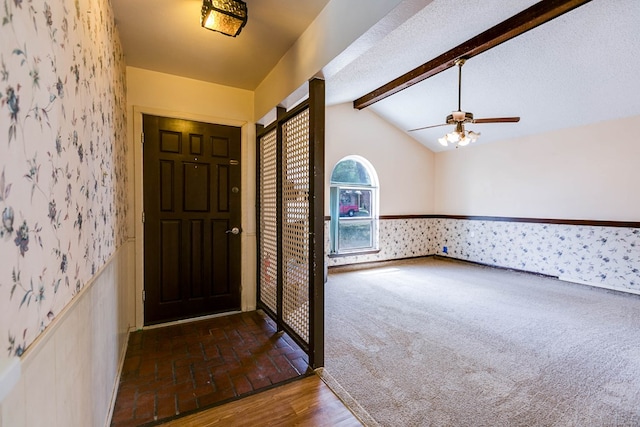 2756 Eunice Dr, San Angelo, TX 76901 - carpeted foyer featuring wallpapered walls, a wainscoted wall, and ceiling fan