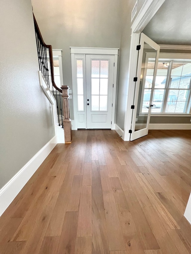 foyer with wood-type flooring