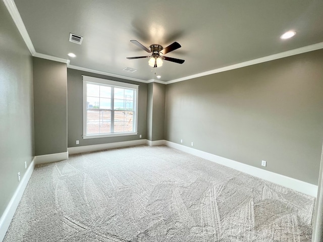 empty room featuring ceiling fan, ornamental molding, and light carpet