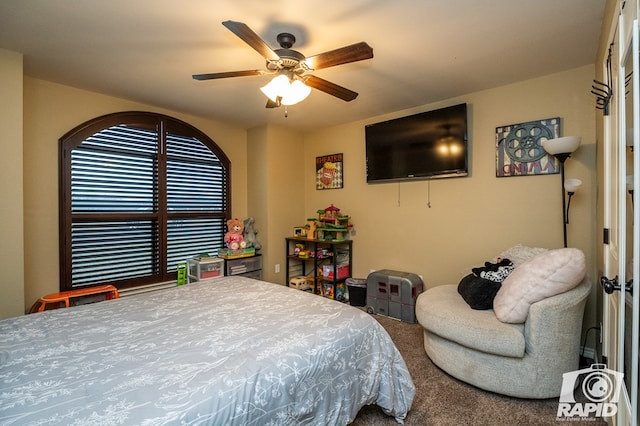 carpeted bedroom featuring ceiling fan