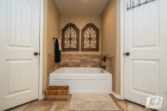 bathroom featuring a bath and tile patterned flooring