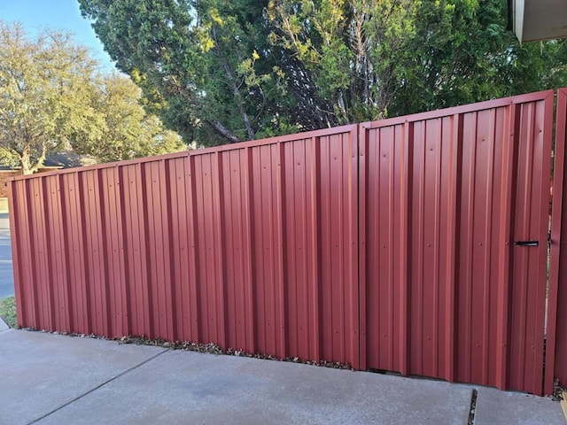 view of gate featuring fence