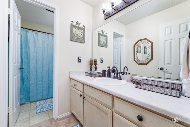 full bathroom with vanity, curtained shower, and tile patterned flooring