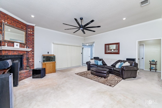 carpeted living area featuring visible vents, a brick fireplace, a textured ceiling, and ornamental molding