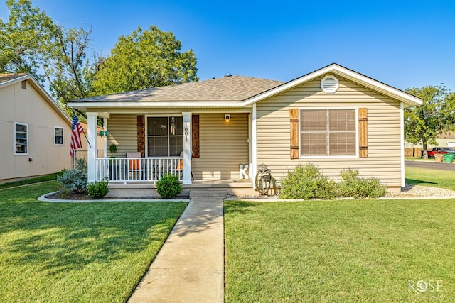 1601 S Jackson St, San Angelo, TX 76903 - view of front of property with a porch, a front yard, and roof with shingles