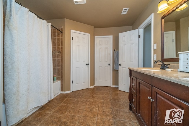 full bath featuring baseboards, double vanity, shower / bathtub combination with curtain, visible vents, and a sink