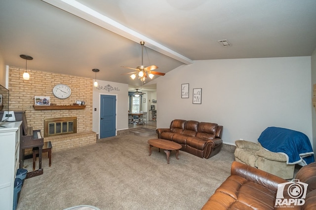 carpeted living area featuring visible vents, ceiling fan, lofted ceiling with beams, and a brick fireplace