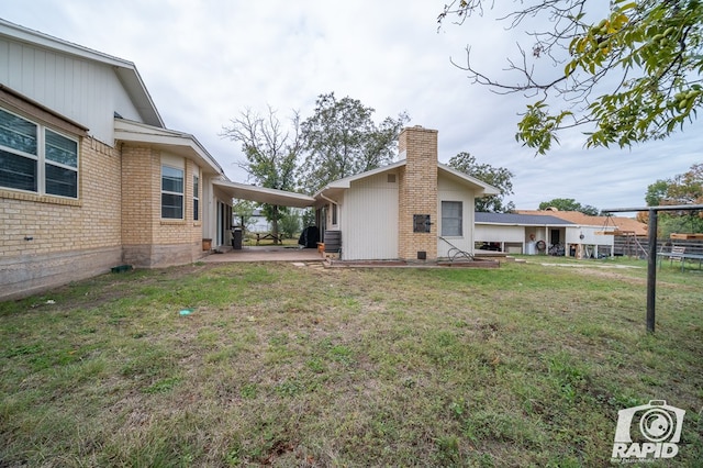 view of yard with an attached carport