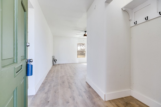 hallway with light wood-type flooring