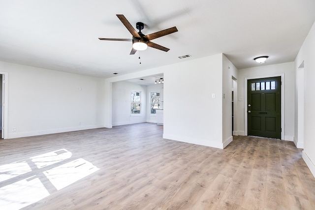 interior space with light hardwood / wood-style floors and ceiling fan