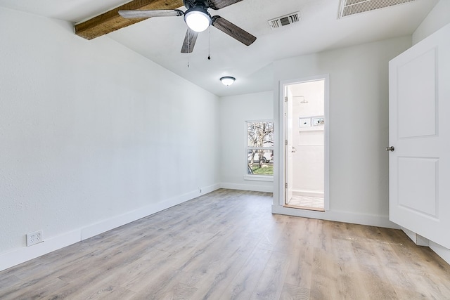 empty room featuring beam ceiling, ceiling fan, and light wood-type flooring