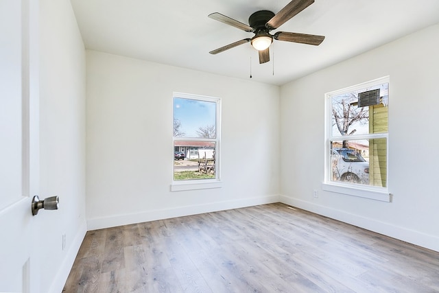 spare room featuring ceiling fan and light hardwood / wood-style flooring