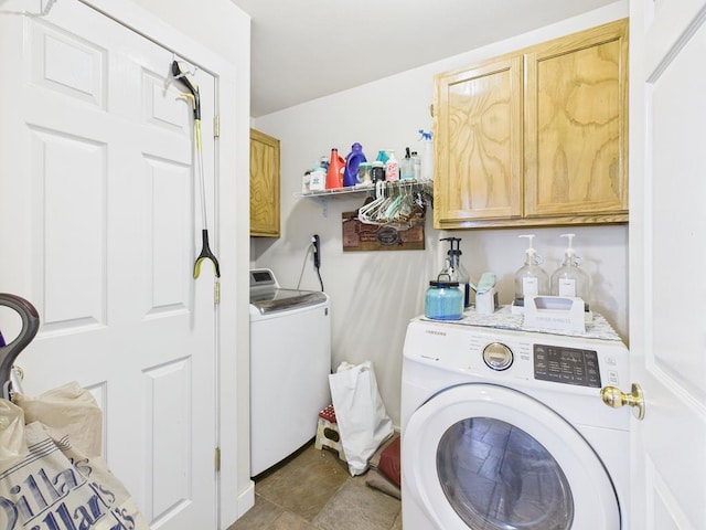 675 Buffalo Ln, San Angelo, TX 76901 - laundry room featuring separate washer and dryer and cabinet space