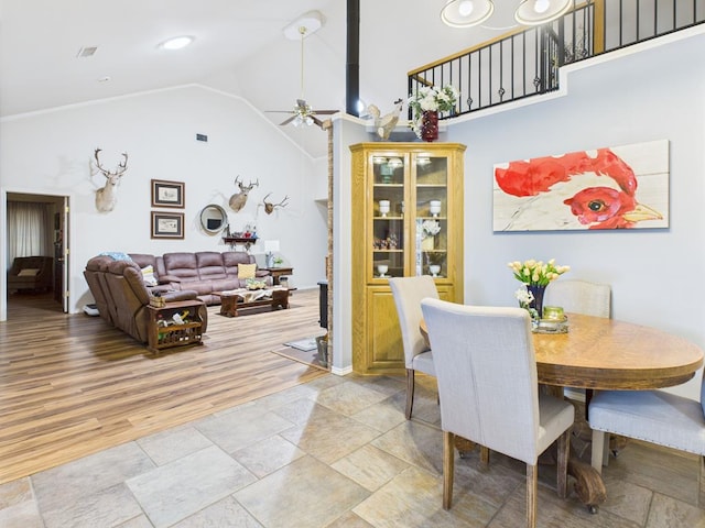 675 Buffalo Ln, San Angelo, TX 76901 - dining space featuring high vaulted ceiling, a ceiling fan, and light wood-type flooring