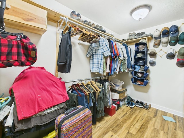 675 Buffalo Ln, San Angelo, TX 76901 - spacious closet featuring wood finished floors