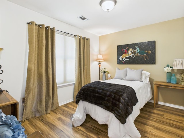 675 Buffalo Ln, San Angelo, TX 76901 - bedroom featuring wood finished floors and baseboards