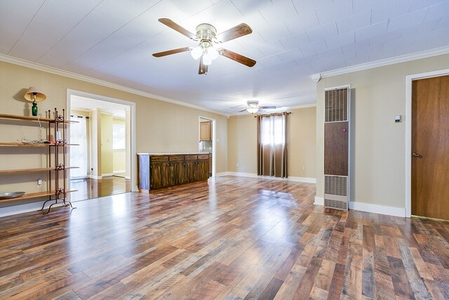 unfurnished room featuring ornamental molding, hardwood / wood-style floors, and ceiling fan