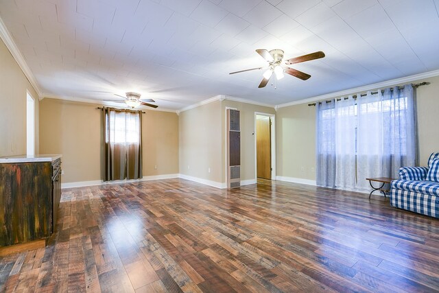 unfurnished living room featuring crown molding, dark wood-type flooring, and ceiling fan