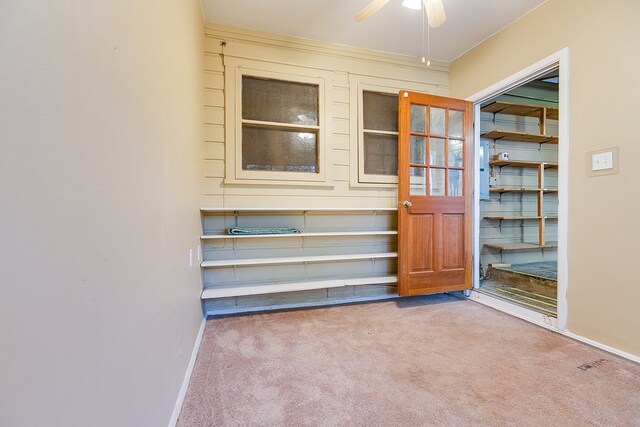 interior space with ceiling fan