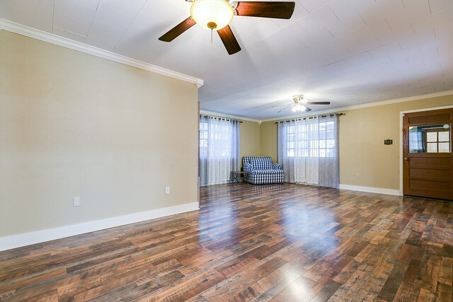 unfurnished living room with crown molding, ceiling fan, and dark hardwood / wood-style floors