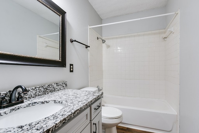 bathroom with bathing tub / shower combination, vanity, toilet, and wood finished floors