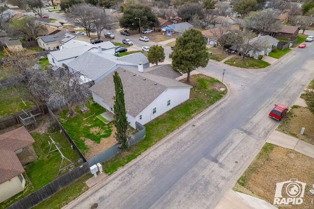 birds eye view of property with a residential view